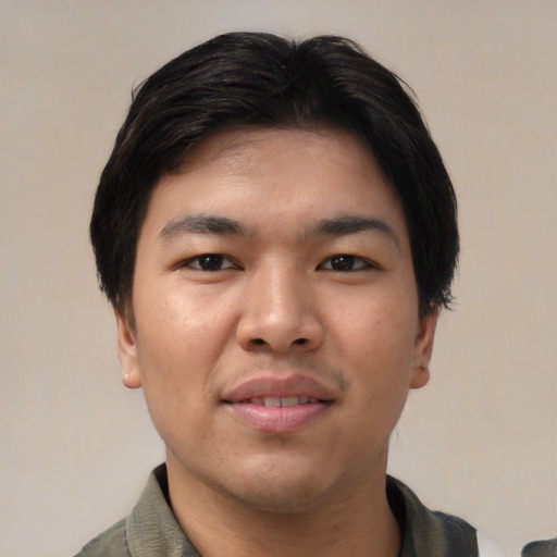 Joyful asian young-adult male with medium  black hair and brown eyes
