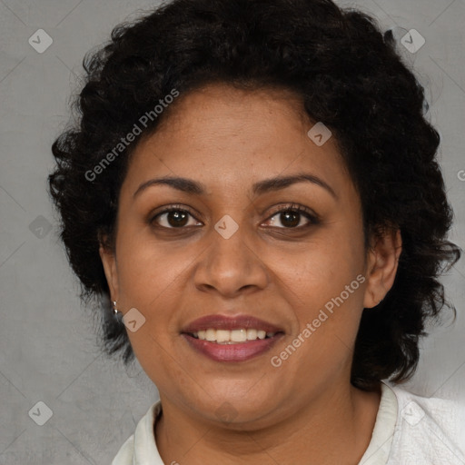 Joyful black adult female with short  brown hair and brown eyes