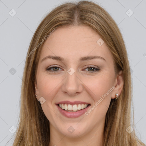 Joyful white young-adult female with long  brown hair and brown eyes