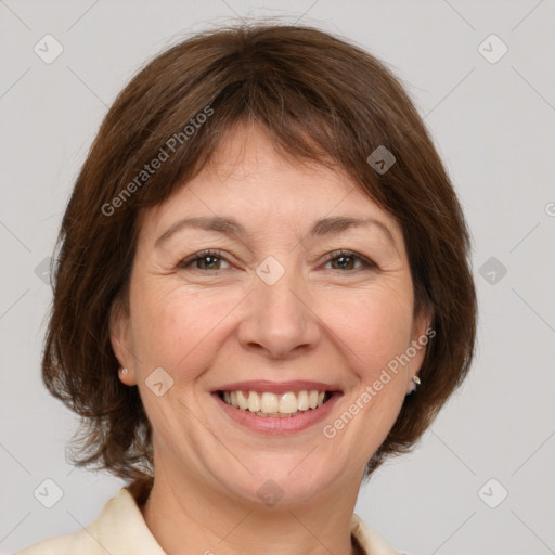 Joyful white adult female with medium  brown hair and brown eyes