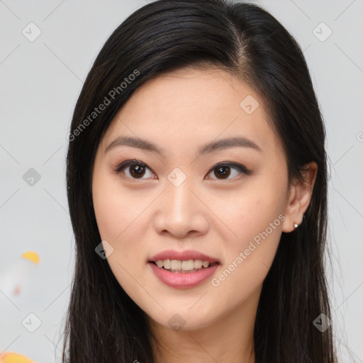 Joyful asian young-adult female with long  brown hair and brown eyes