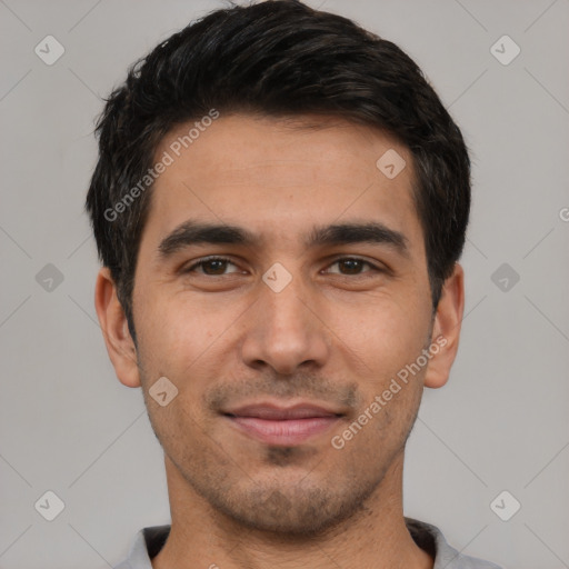 Joyful white young-adult male with short  black hair and brown eyes