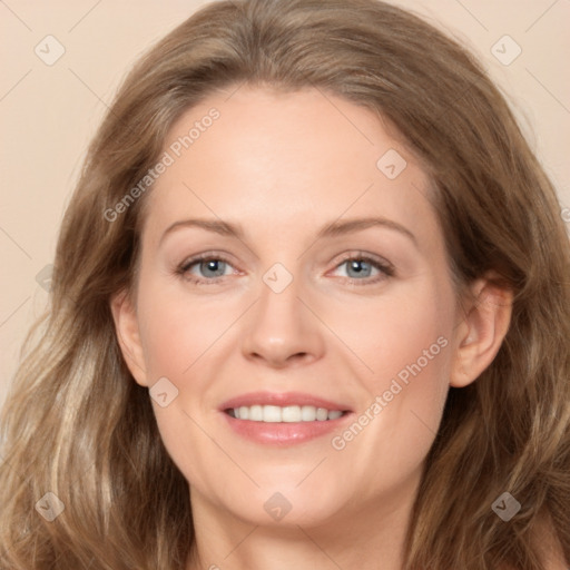 Joyful white adult female with long  brown hair and grey eyes