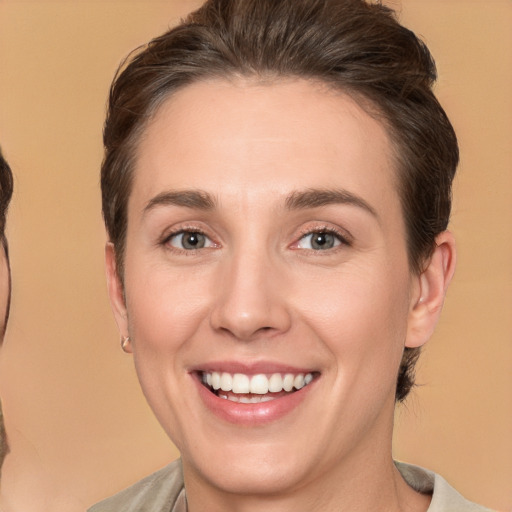 Joyful white young-adult female with medium  brown hair and brown eyes