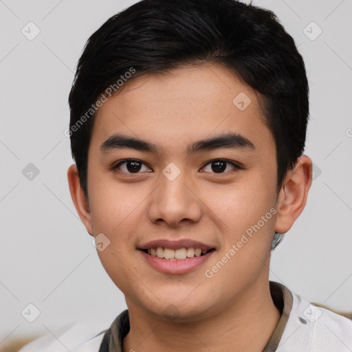 Joyful asian young-adult male with short  brown hair and brown eyes