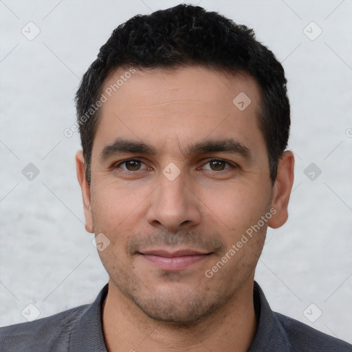 Joyful white young-adult male with short  black hair and brown eyes