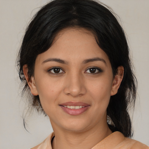 Joyful white young-adult female with medium  black hair and brown eyes