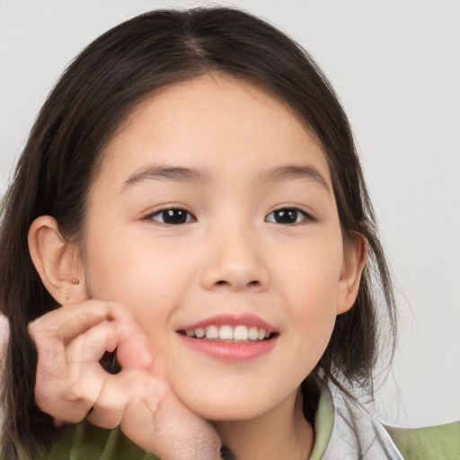 Joyful white child female with medium  brown hair and brown eyes