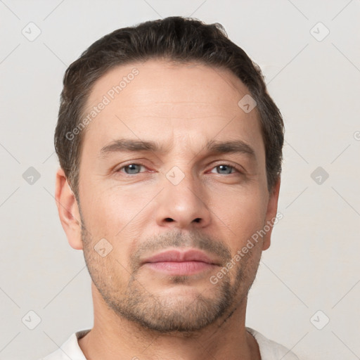 Neutral white young-adult male with short  brown hair and brown eyes