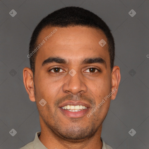 Joyful latino young-adult male with short  brown hair and brown eyes