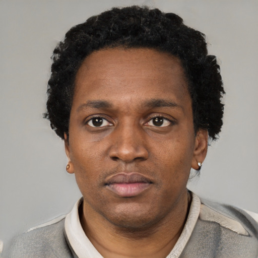 Neutral latino adult male with short  black hair and brown eyes