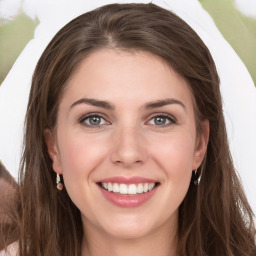 Joyful white young-adult female with long  brown hair and green eyes