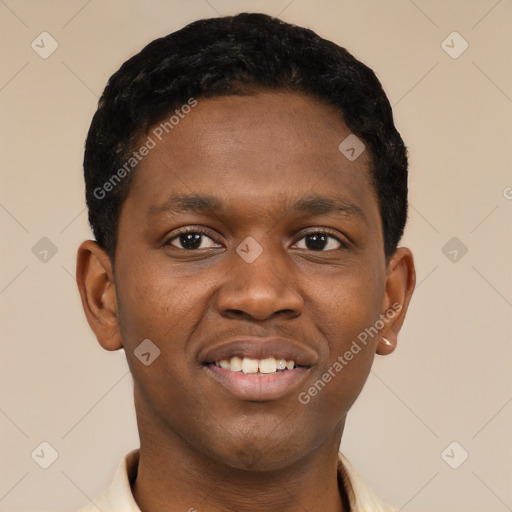 Joyful black young-adult male with short  brown hair and brown eyes