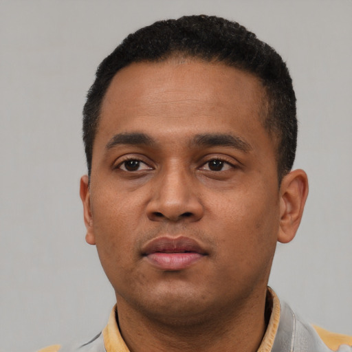 Neutral latino young-adult male with short  black hair and brown eyes