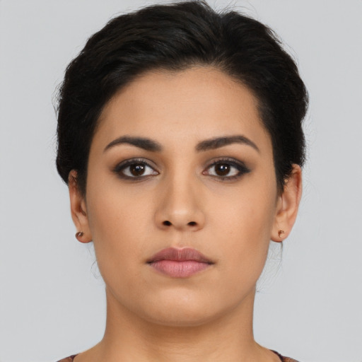Neutral latino young-adult female with short  brown hair and brown eyes
