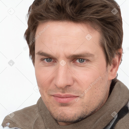 Joyful white adult male with short  brown hair and grey eyes