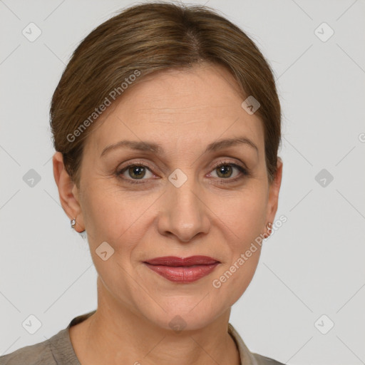 Joyful white adult female with short  brown hair and grey eyes