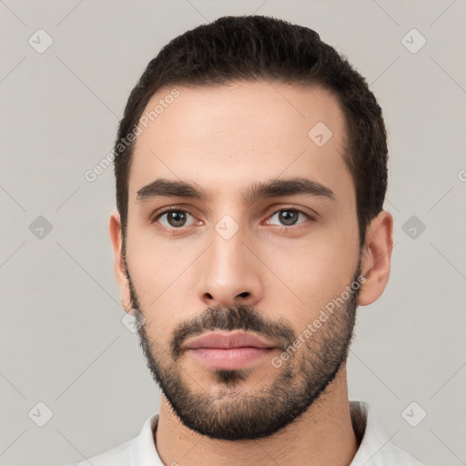 Neutral white young-adult male with short  black hair and brown eyes