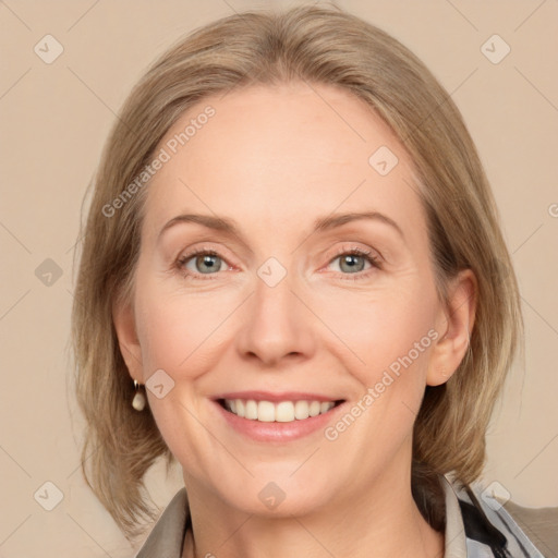 Joyful white adult female with medium  brown hair and blue eyes