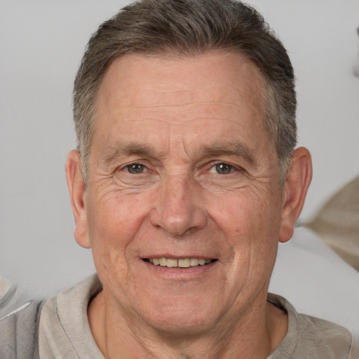 Joyful white middle-aged male with short  brown hair and brown eyes