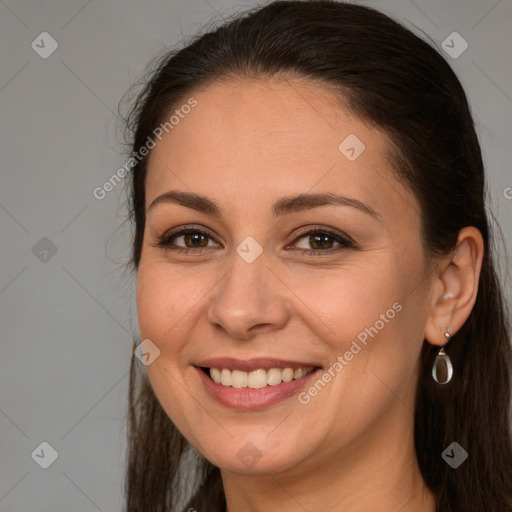 Joyful white young-adult female with long  brown hair and brown eyes