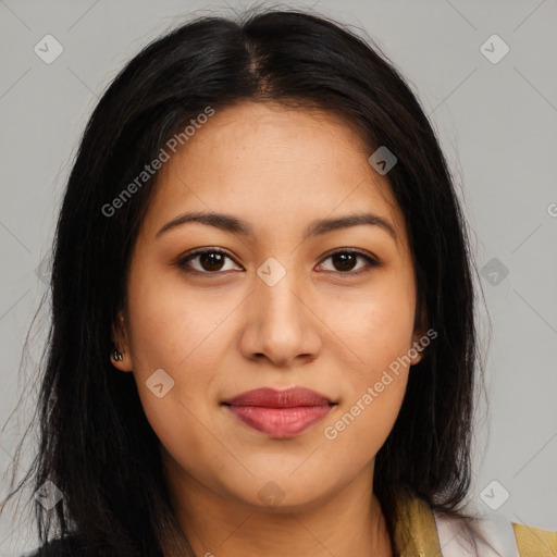 Joyful latino young-adult female with long  brown hair and brown eyes