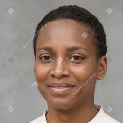 Joyful black young-adult female with short  black hair and brown eyes