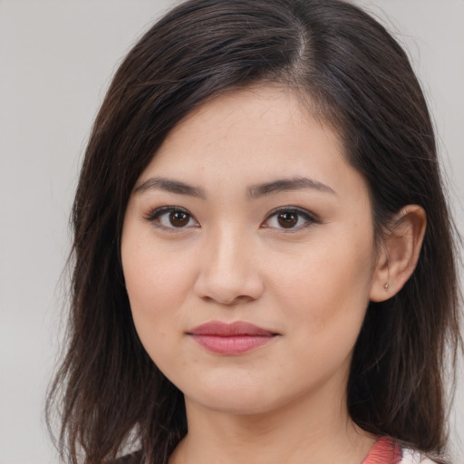 Joyful white young-adult female with long  brown hair and brown eyes