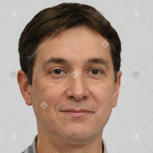 Joyful white adult male with short  brown hair and brown eyes