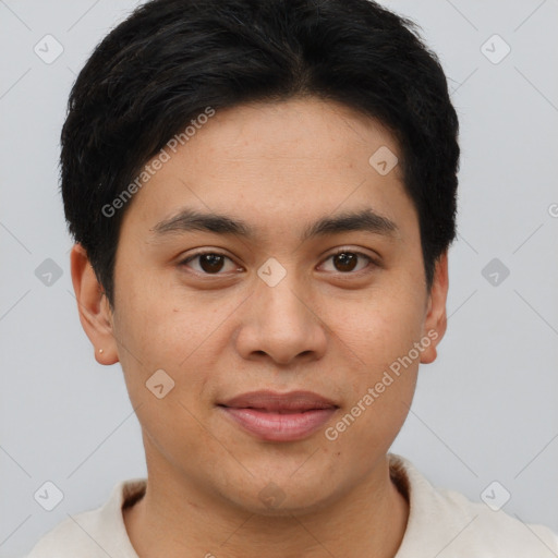 Joyful asian young-adult male with short  brown hair and brown eyes