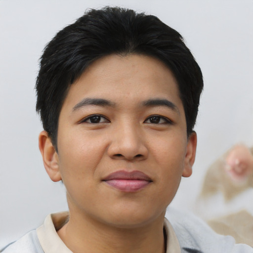 Joyful asian young-adult male with short  black hair and brown eyes