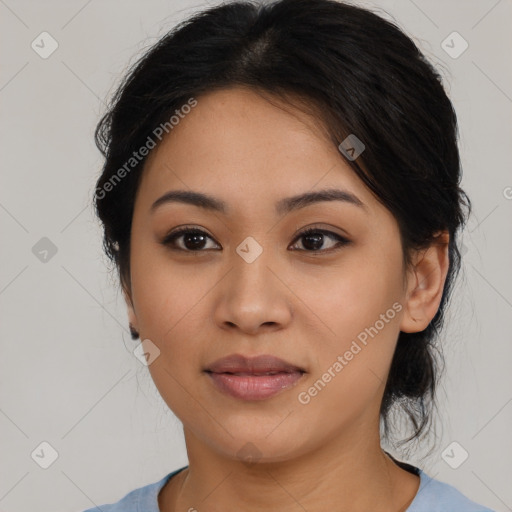 Joyful latino young-adult female with medium  brown hair and brown eyes