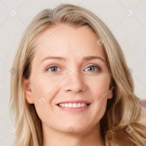 Joyful white young-adult female with long  brown hair and blue eyes