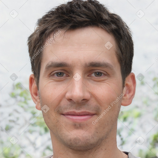 Joyful white young-adult male with short  brown hair and brown eyes