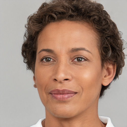 Joyful white adult female with short  brown hair and brown eyes