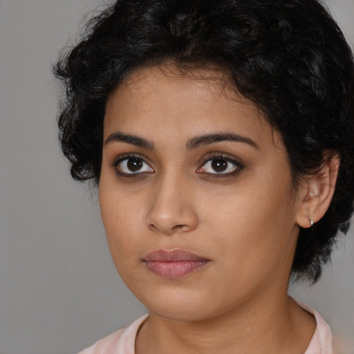 Neutral latino young-adult female with medium  black hair and brown eyes