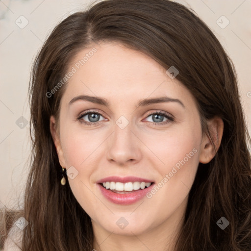 Joyful white young-adult female with long  brown hair and grey eyes