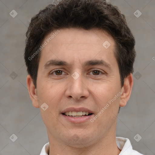 Joyful white adult male with short  brown hair and brown eyes