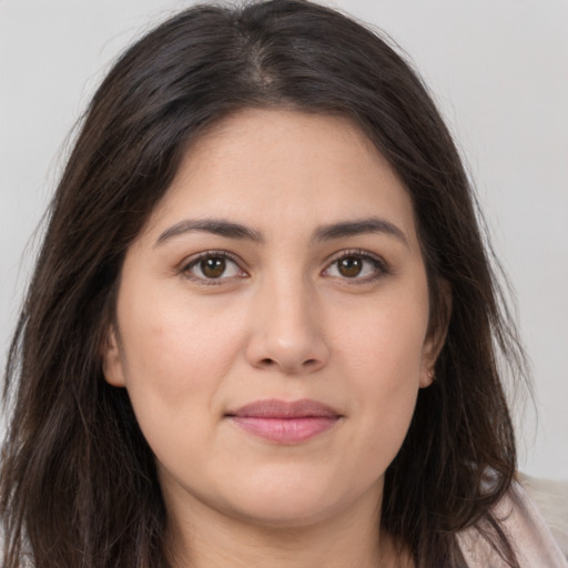 Joyful white young-adult female with long  brown hair and brown eyes