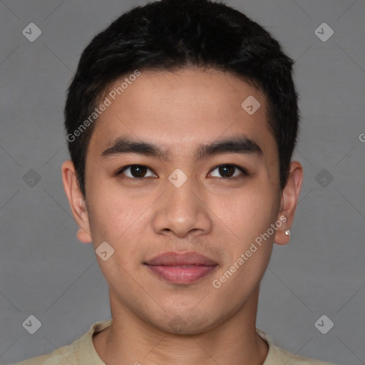 Joyful latino young-adult male with short  brown hair and brown eyes