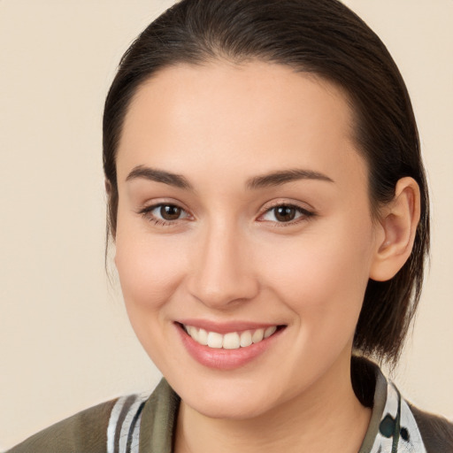 Joyful white young-adult female with medium  brown hair and brown eyes