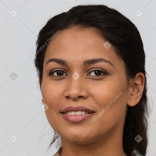 Joyful latino young-adult female with long  brown hair and brown eyes