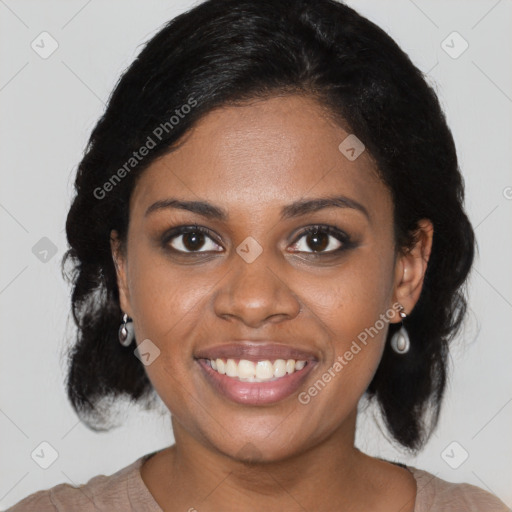 Joyful black young-adult female with medium  black hair and brown eyes