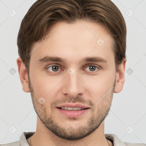 Joyful white young-adult male with short  brown hair and grey eyes