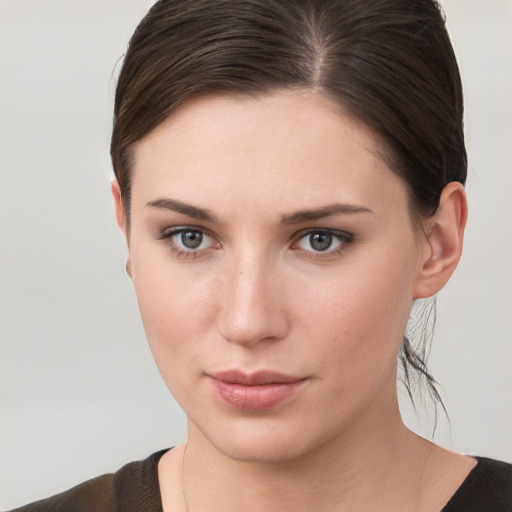 Neutral white young-adult female with short  brown hair and brown eyes