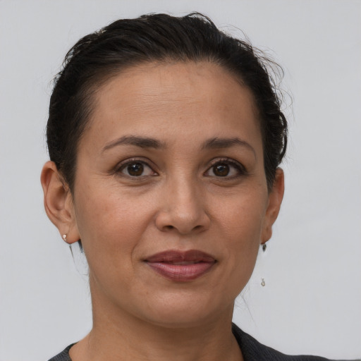 Joyful white adult female with short  brown hair and brown eyes