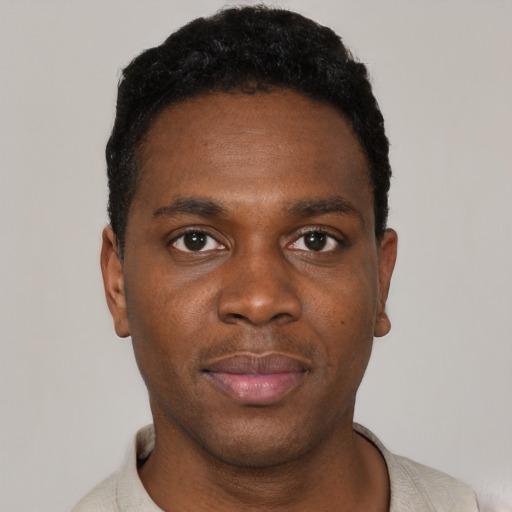 Neutral black young-adult male with short  black hair and brown eyes