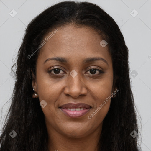 Joyful black young-adult female with long  brown hair and brown eyes