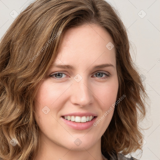 Joyful white young-adult female with long  brown hair and green eyes