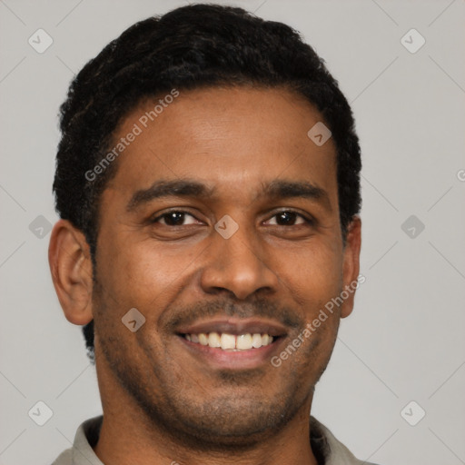 Joyful latino young-adult male with short  black hair and brown eyes